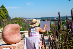 Miranda, drawing in the garden. The landscape beyond forms part of the Clarendon Palace estate. (Photo: Olivia Chapple)